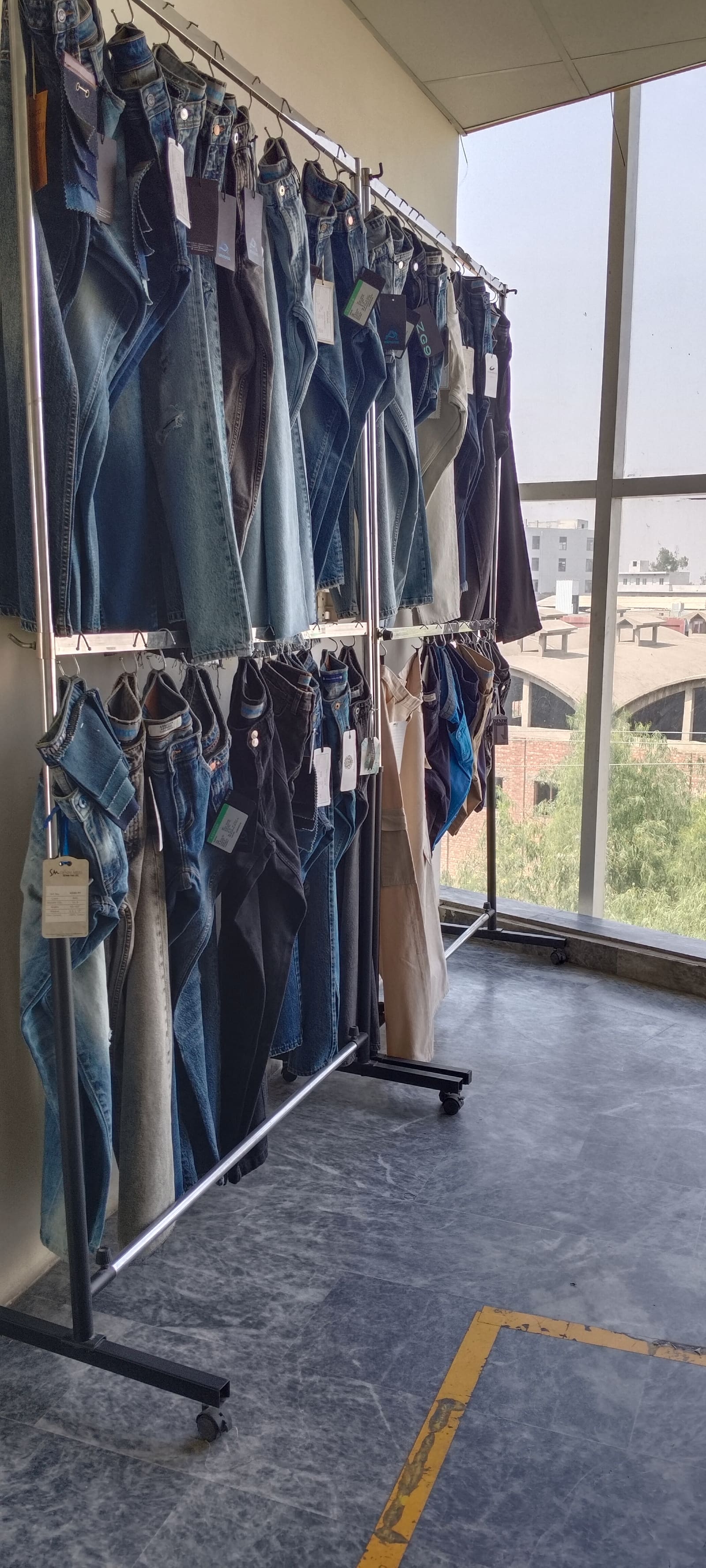 Finished garments on cutting table at Eco Vira