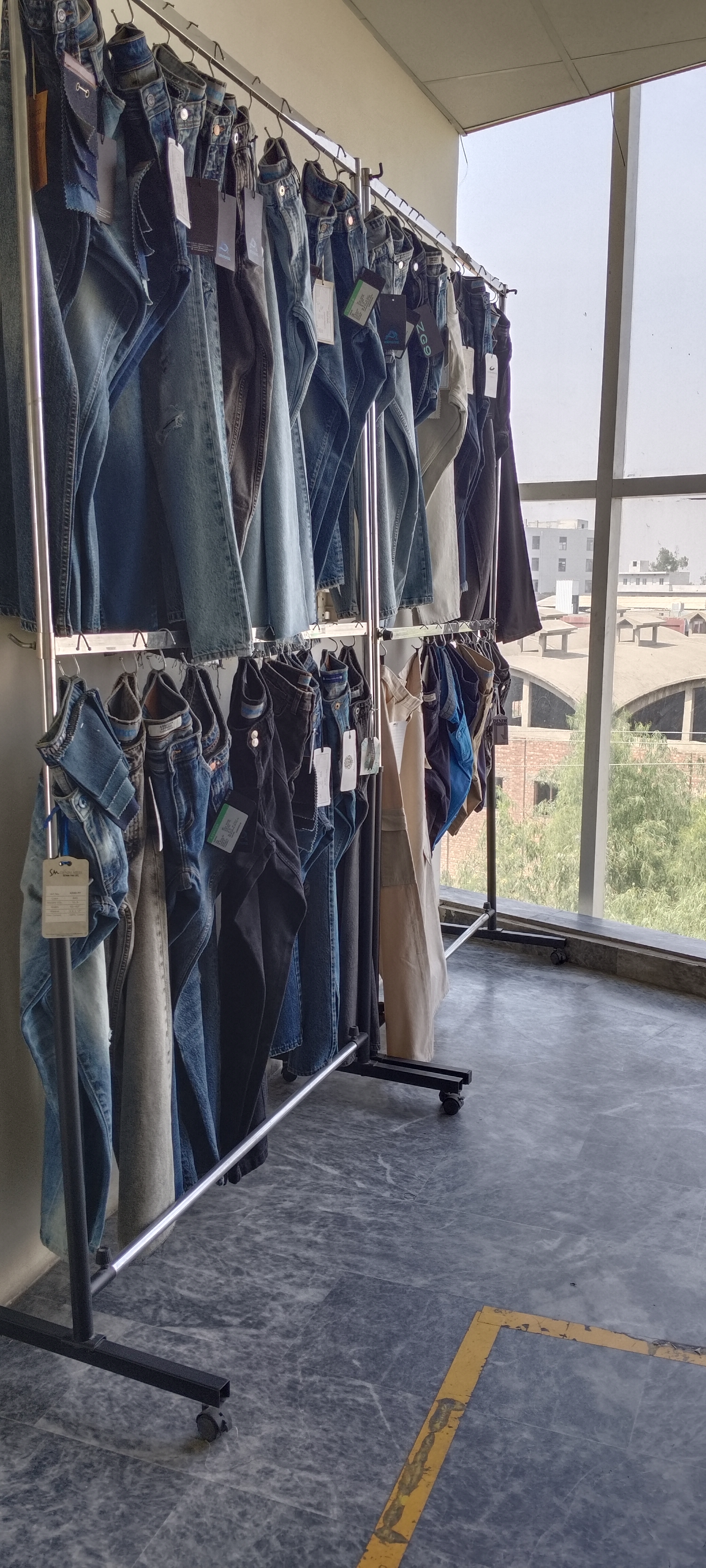 Finished garments on cutting table at Eco Vira
